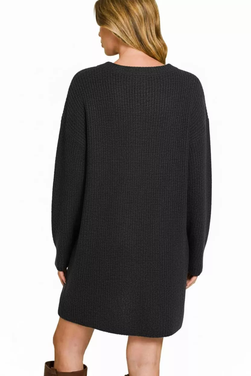 Back view: black long-sleeve ribbed sweater dress with rounded neckline and straight hem