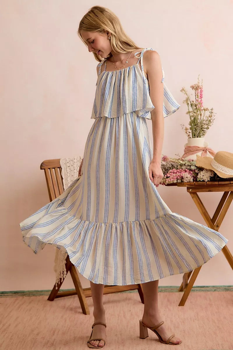 Blue and white striped tiered midi dress with ruffled shoulder tie straps