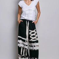 Off-white textured knit V-neck short-sleeve top with lace-trimmed neckline