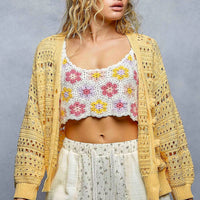 Yellow open-knit button cardigan with scalloped trim, long sleeves, and ribbed cuffs