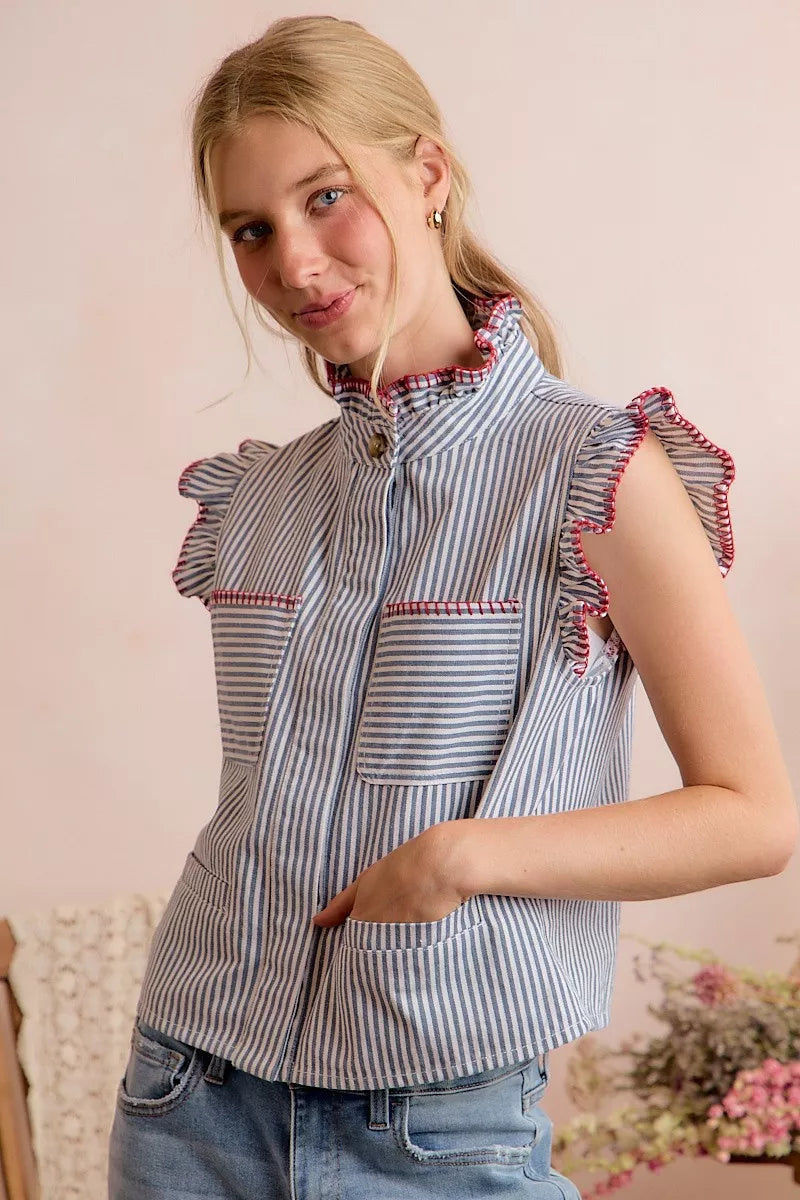 Blue and white striped sleeveless vest top with ruffled shoulders and hidden button