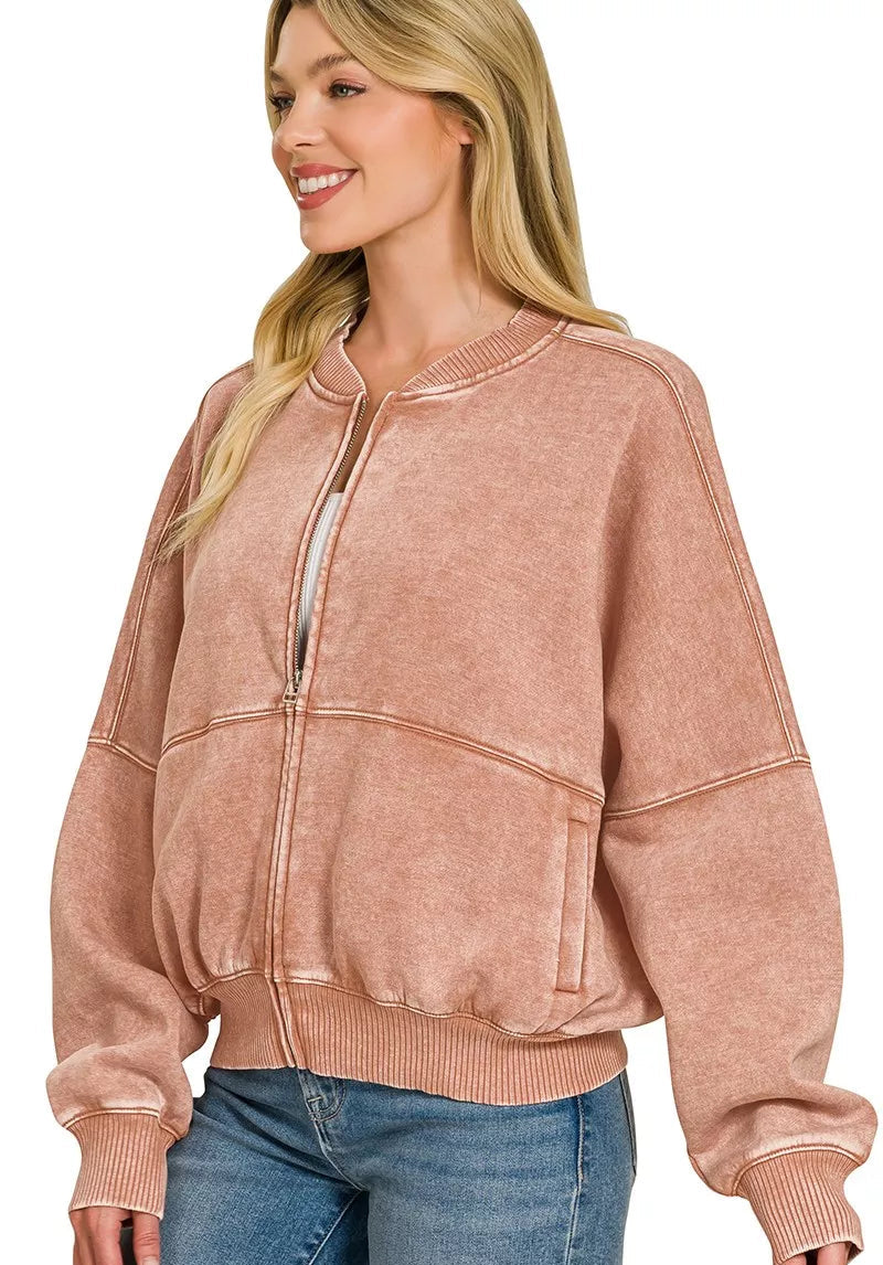 Rust acid-washed fleece zip jacket with kangaroo-style front pocket and ribbed cuffs