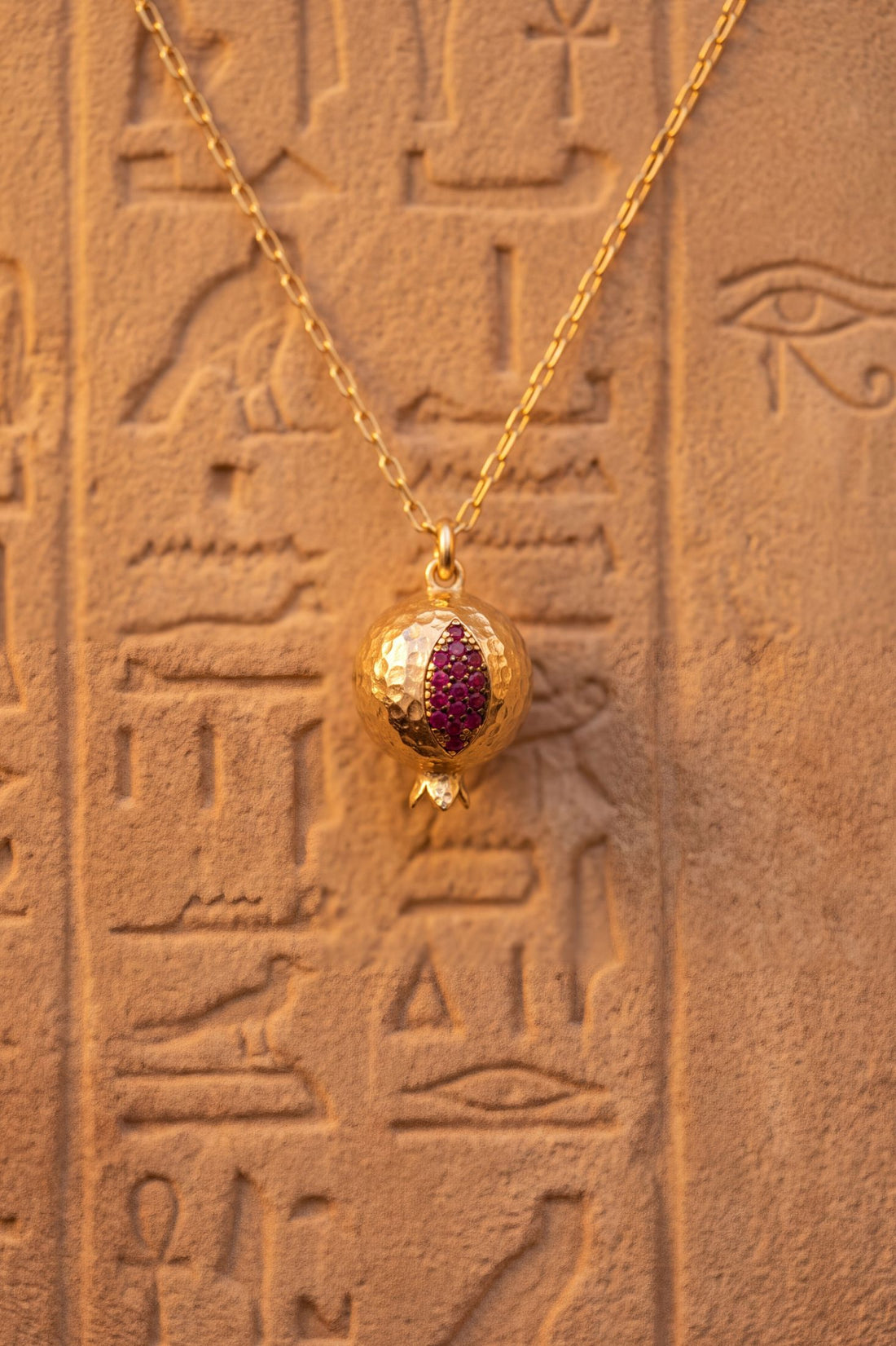 Gold-tone pomegranate charm necklace pendant with purple and pink enamel detail