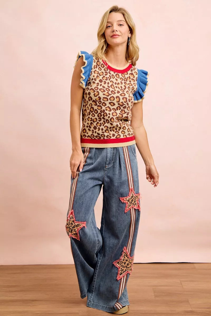 Leopard print knit tank top featuring blue ruffled shoulders and red collar trim