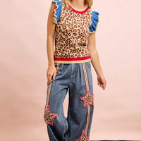 Leopard print knit tank top featuring blue ruffled shoulders and red collar trim