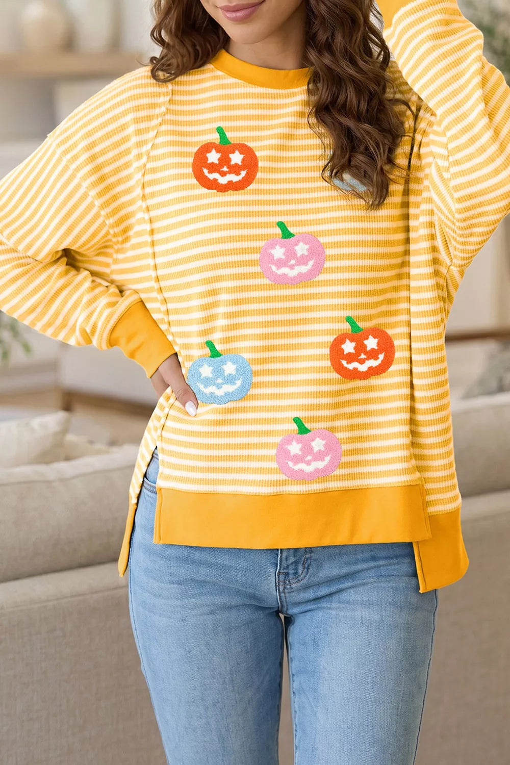Yellow striped Halloween waffle-knit pullover with pumpkin face graphic, crew neck