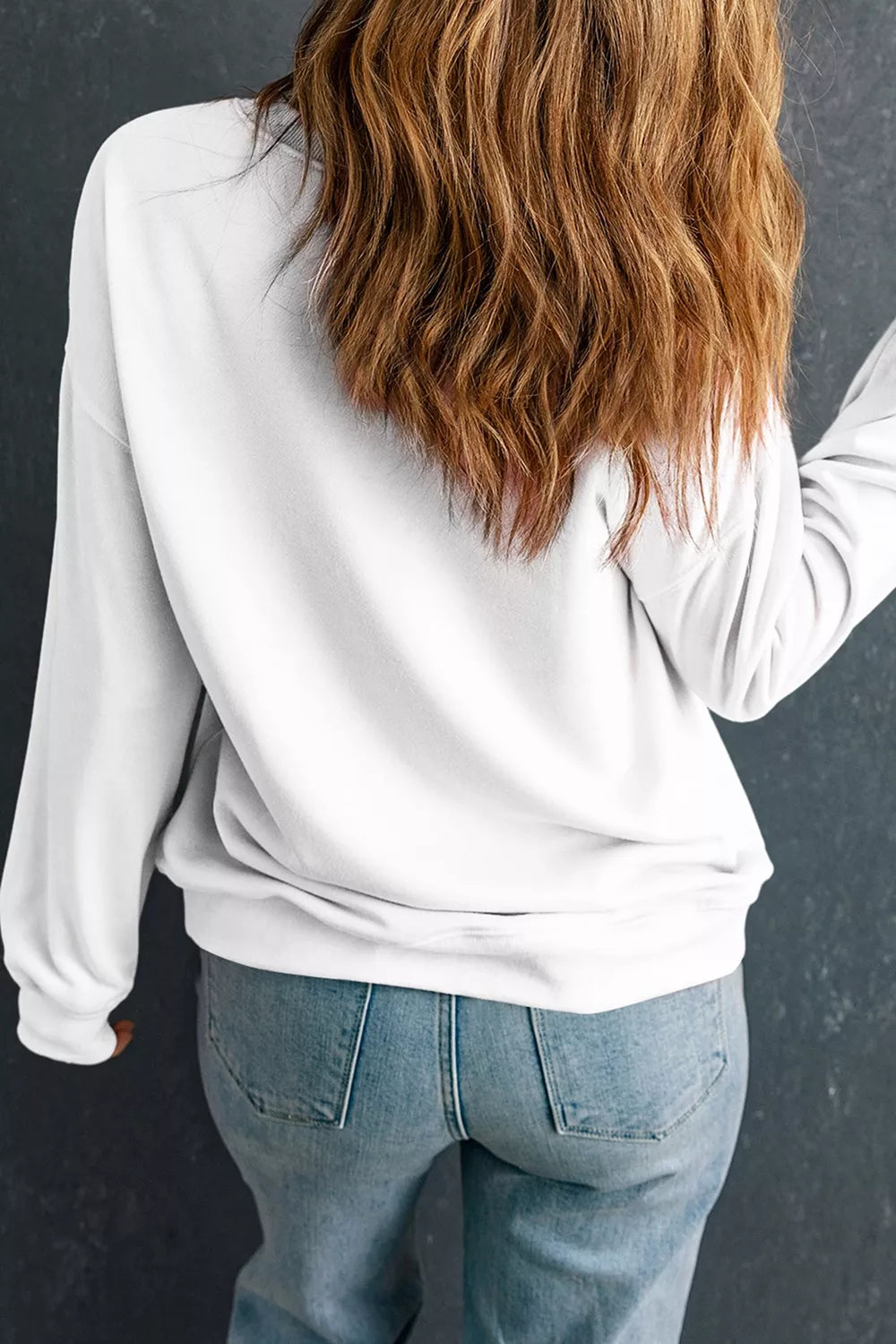 White pullover sweatshirt, back view, crew neck and long sleeves