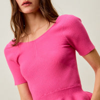 Hot pink ribbed knit peplum sweater top, short sleeves and ruffled hem detail