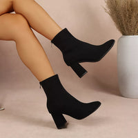 Black point-toe block-heel ankle boots, side view with thick stacked heel