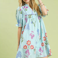 Seafoam blue floral V-neck dress with short puff sleeves and tiered skirt