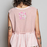 Powder pink sleeveless top, back view, gathered ruffle hem with floral patch pockets