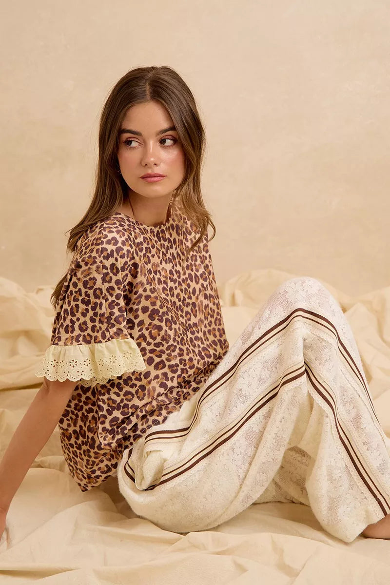 Leopard print ruffled top with eyelet lace cuffs and cream striped shorts
