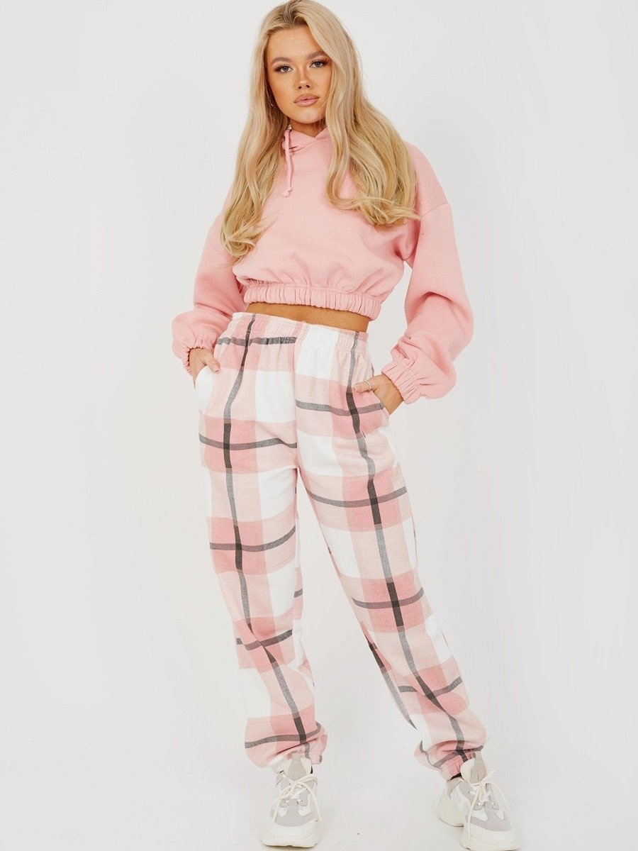 Pink and white checked joggers with elastic cuffs and drawstring waist