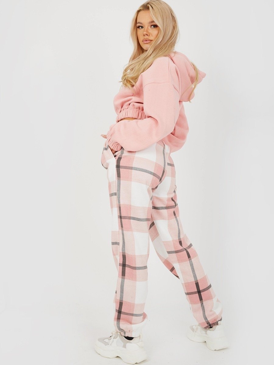 Light pink plaid joggers with side pockets and ankle cuffs.