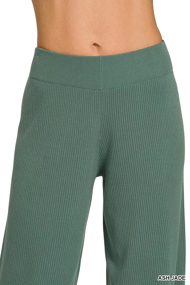 Teal-green wide-leg pants with elastic knit waistband and ribbed texture