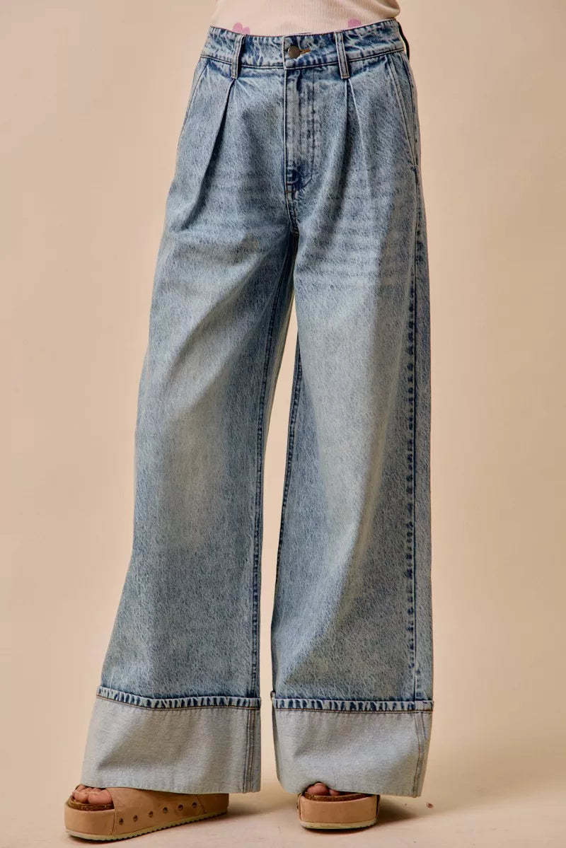 Light-wash mid-rise wide-leg denim jeans with pleated waist and cuffed hem