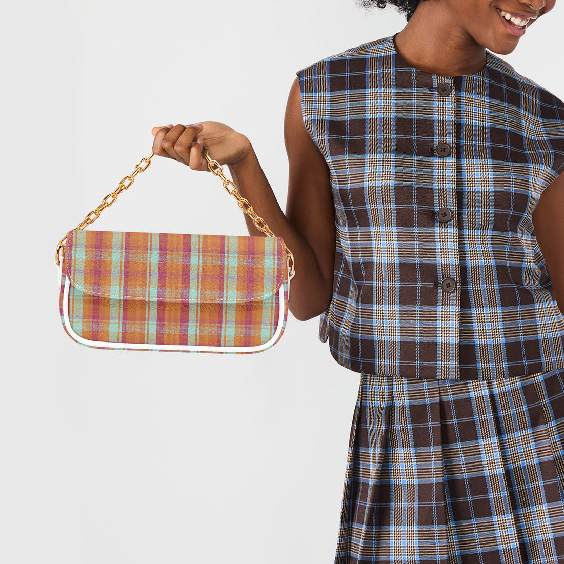 Plaid shoulder bag with white strap and gold chain, front flap