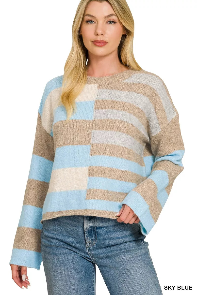 Lightweight color block sweater with sky blue sleeves and beige, white stripe blocks