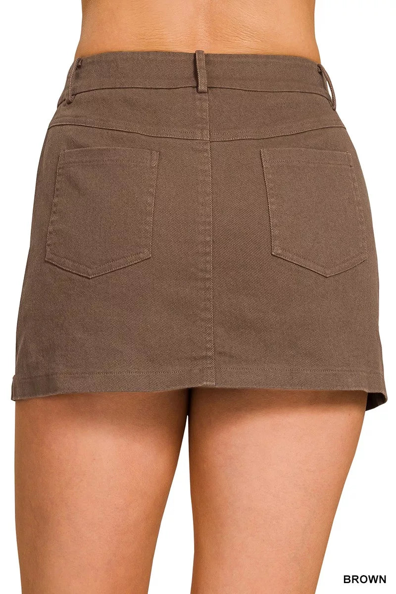 Brown cotton twill mini skirt with belt loops, button fly, two front patch pockets