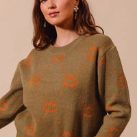 Olive crewneck sweater with orange pumpkin rhombus icons, long sleeves