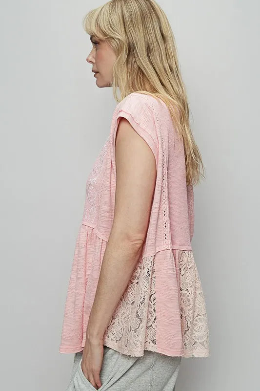 Blush pink lace peplum blouse with embroidered boat neck, cap sleeves—side view