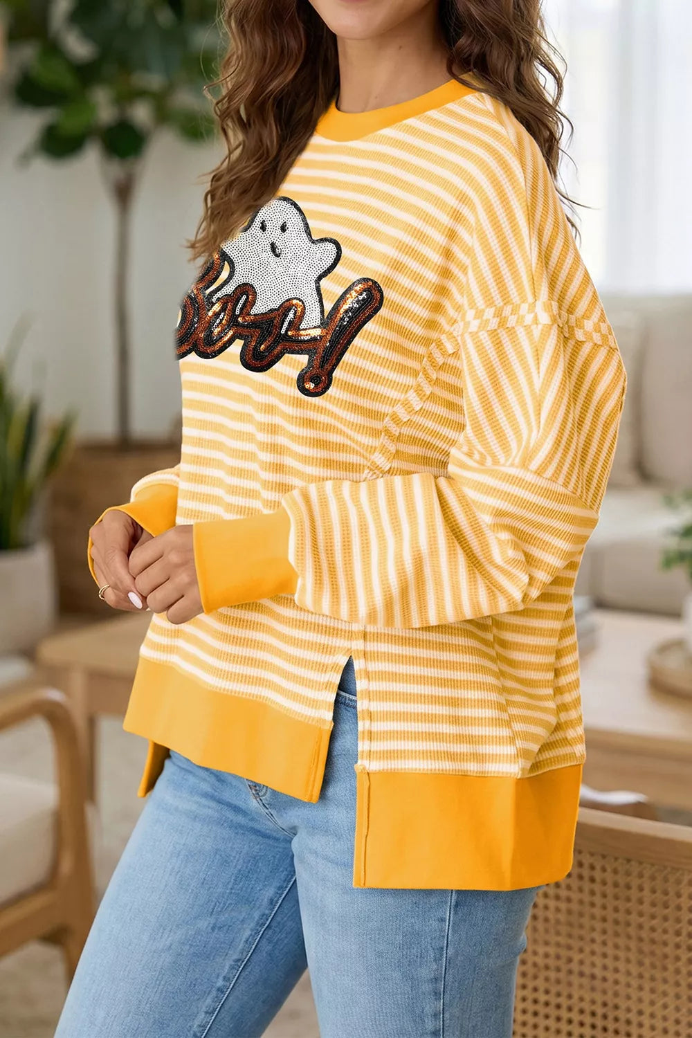 Gold and white striped long-sleeve Halloween top with sequin ghost “Boo!” graphic