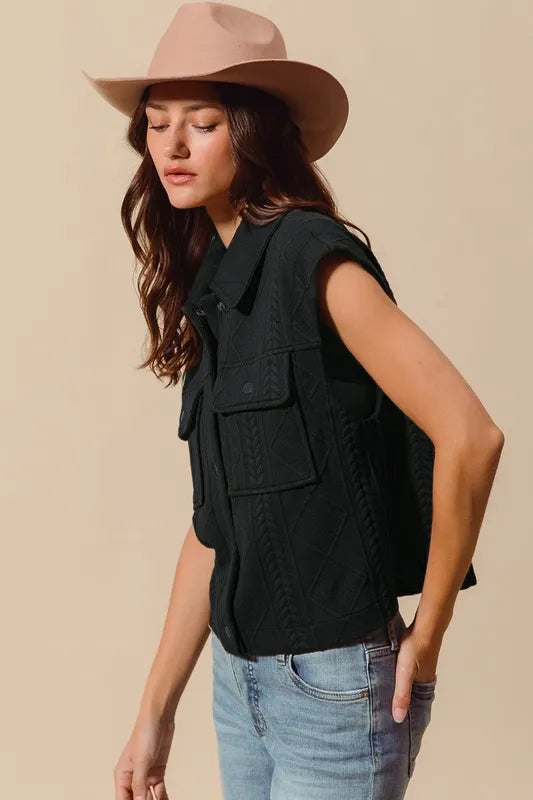 Black quilted knit button-up vest with flap chest pocket and button front