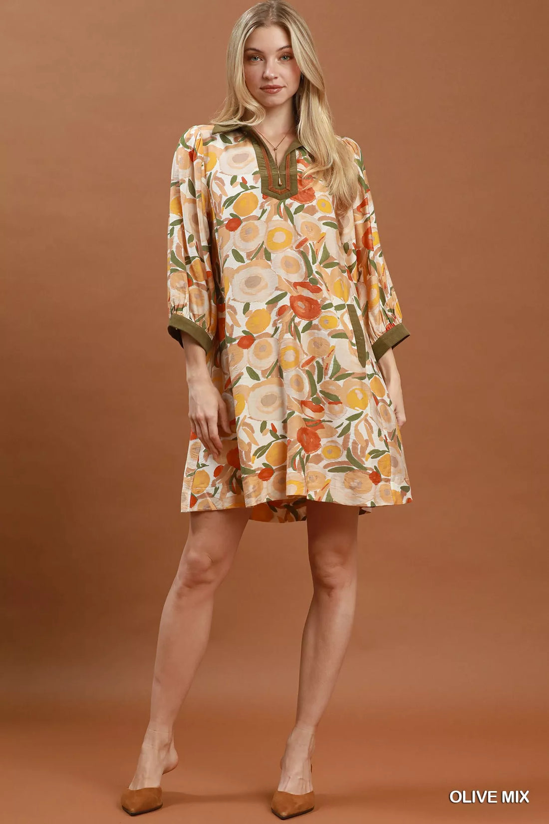 Floral shift mini dress with olive contrast trim, three-quarter sleeves, and mini length
