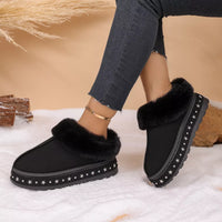 Black faux fur lined platform ankle boots, side view with star trim on sole