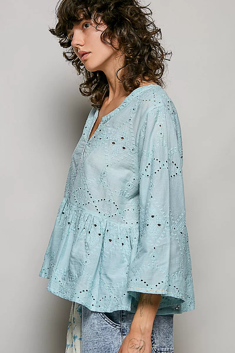 Aqua cotton eyelet peplum button-front shirt, V-neck, side view with full sleeves