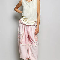 Beige ribbed sleeveless tank with lace-trim round neckline