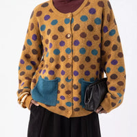 Plus-size mustard polka-dot button cardigan with two blue patch pockets, long sleeves