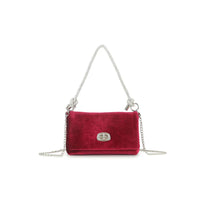 Cherry red velvet evening bag with silver chain shoulder straps and front clasp