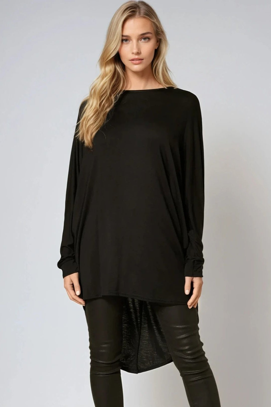 Oversized black batwing top with high-low hem, wide elbow-length sleeves