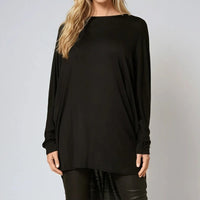 Oversized black batwing top with high-low hem, wide elbow-length sleeves