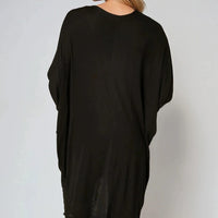 Back view of oversized black batwing top with high-low hem and long drape