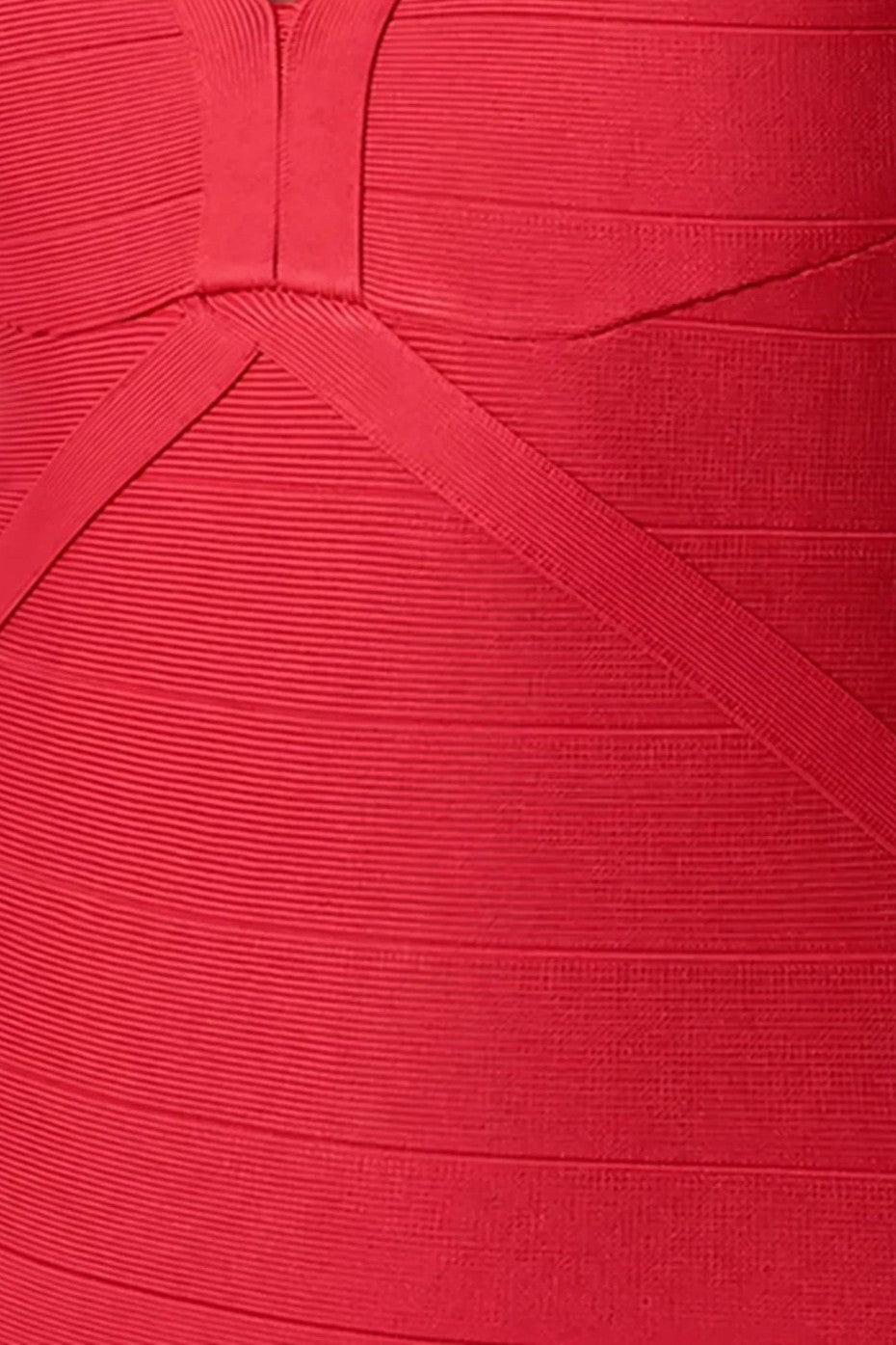 Red bandage dress close-up: ribbed texture with diagonal seam paneling