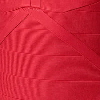 Red bandage dress close-up: ribbed texture with diagonal seam paneling