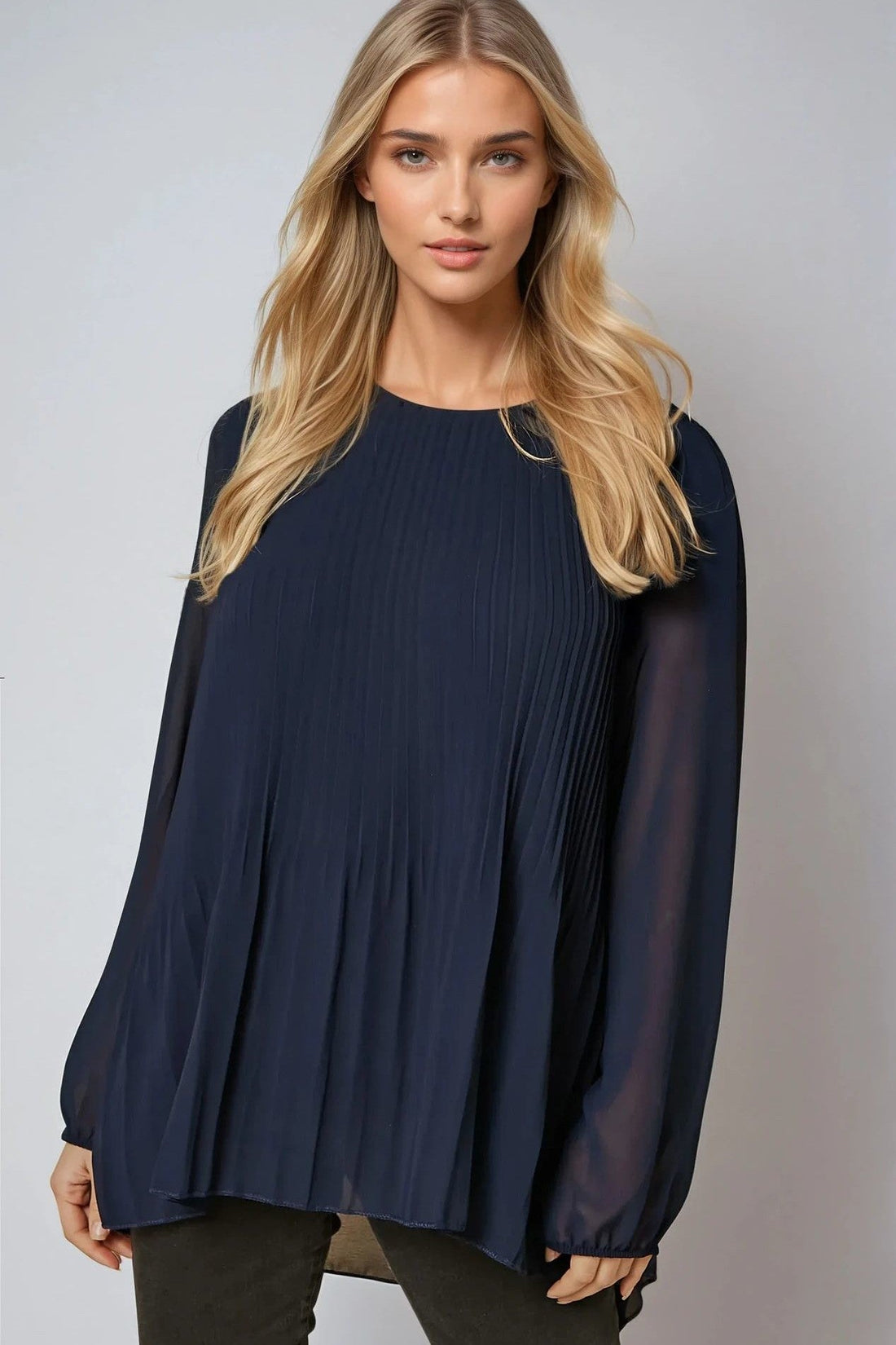 Navy long-sleeve pleated blouse with loose drape and round neckline