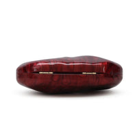 Burgundy oval clutch bag with gold bar clasp on top