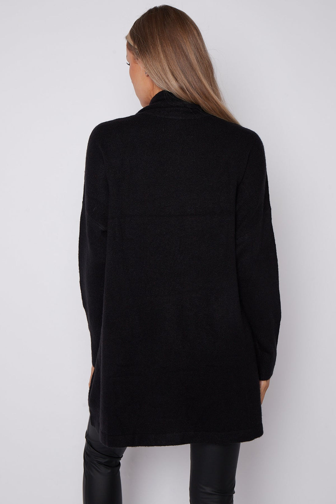 Black fringed shawl-collar cardigan, back view with long sleeves and tassel hem