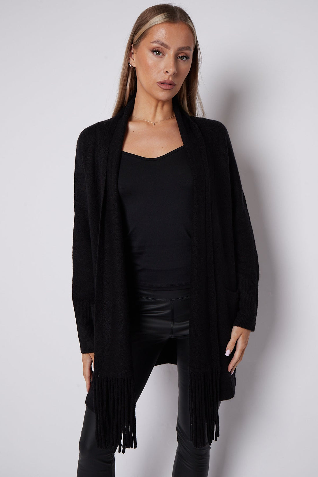Black fringed shawl-collar cardigan with open front and long sleeves