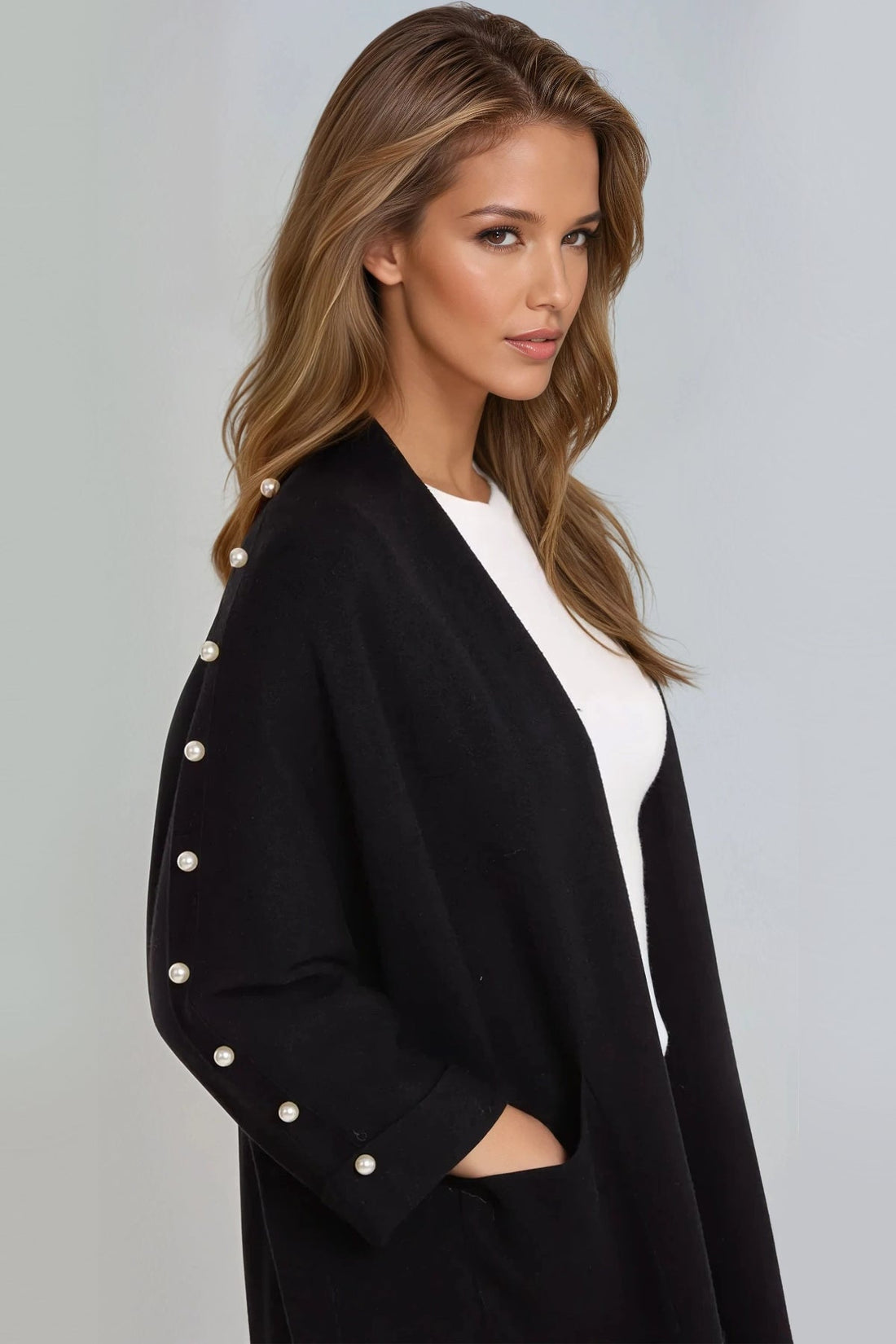 Black open-front cardigan with pearl-embellished sleeve and three-quarter sleeves