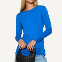 Royal blue round-neck long-sleeve top, side view with smooth knit