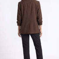 Brown open-back blazer with shawl collar style and ruched sleeve detailing