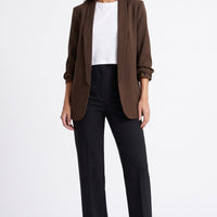 Brown blazer with open front, shawl collar, and ruched three-quarter sleeves