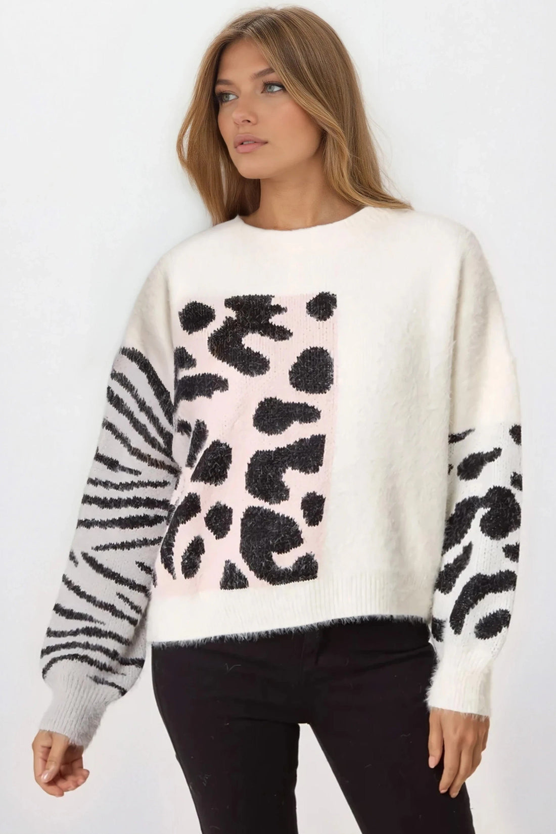 Ivory knit jumper with front spotted graphic, zebra-striped sleeves, and ribbed hem