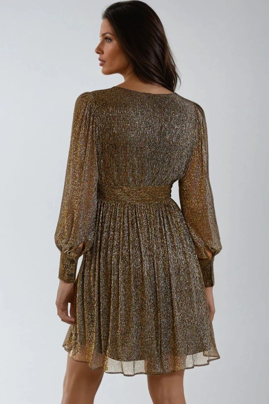Metallic gold mini dress, long sleeves, back view with pleated skirt