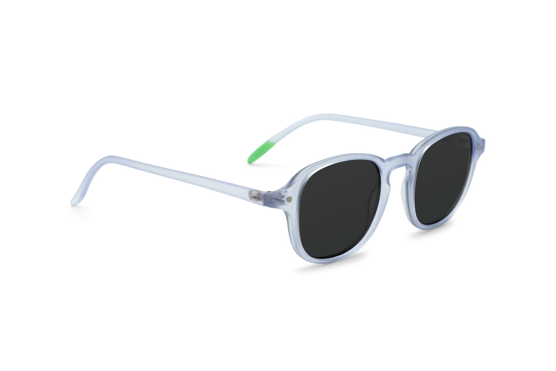 Arly sunglasses, side view: light blue frame with dark lenses and green temple tips