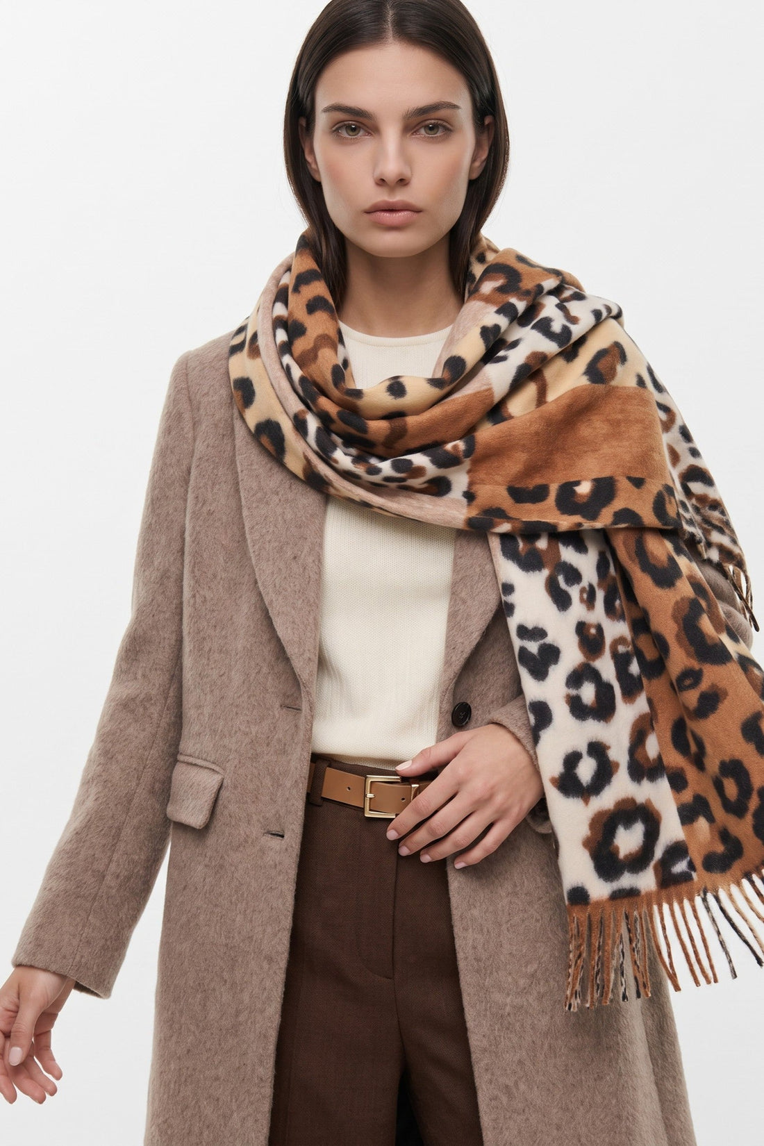 Leopard-spotted print scarf in brown and cream with color blocks and tassel fringe
